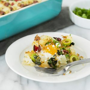 Hot Mediterranean breakfast of baked eggs on a plate.