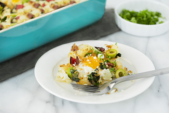 Hot Mediterranean breakfast of baked eggs on a plate.